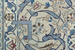 Backside of handmade 2000s Nain rug showing knot structure and weave density