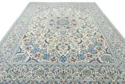 Surface texture of 2000s Nain rug with natural Wool and intricate pattern