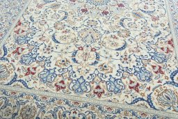 Close-up detail of 2000s Nain rug from Iran / Persia showing Wool weave