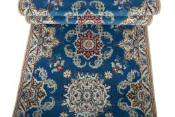 Corner detail of 2000s Nain rug showing border pattern and Wool pile