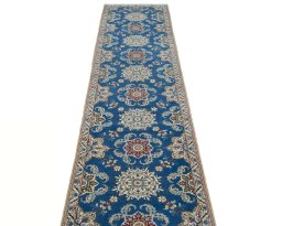 Surface texture of 2000s Nain rug with natural Wool and intricate pattern