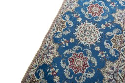 Backside of handmade 2000s Nain rug showing knot structure and weave density