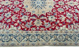 Corner detail of 2000s Nain rug showing border pattern and Wool pile