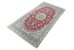 Corner detail of 2000s Nain rug showing border pattern and Wool pile