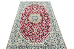 Surface texture of 2000s Nain rug with natural Wool and intricate pattern