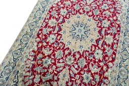 Backside of handmade 2000s Nain rug showing knot structure and weave density