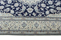 Corner detail of 2000s Nain rug showing border pattern and Wool pile