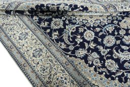 Close-up detail of 2000s Nain rug from Iran / Persia showing Wool weave