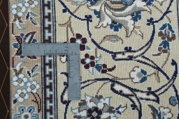 Backside of handmade 2000s Nain rug showing knot structure and weave density
