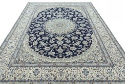 Surface texture of 2000s Nain rug with natural Wool and intricate pattern