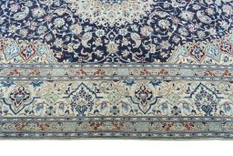 Corner detail of 2000s Nain rug showing border pattern and Wool pile