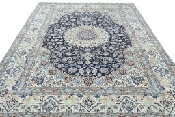 Surface texture of 2000s Nain rug with natural Wool and intricate pattern