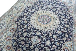 Backside of handmade 2000s Nain rug showing knot structure and weave density