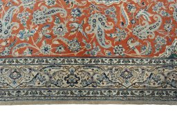 Corner detail of 1970s Nain rug showing border pattern and Cork pile
