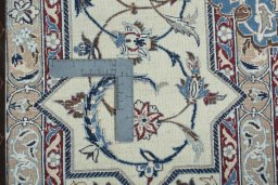 Backside of handmade 2000s Nain rug showing knot structure and weave density