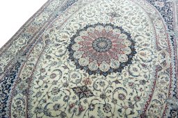 Backside of handmade 2000s Nain rug showing knot structure and weave density