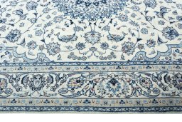 Corner detail of 2000s Nain rug showing border pattern and Wool pile