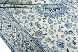 Close-up detail of 2000s Nain rug from Iran / Persia showing Wool weave