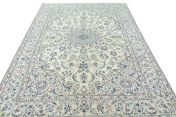 Surface texture of 2000s Nain rug with natural Wool and intricate pattern