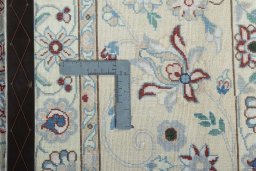 Backside of handmade 2000s Nain rug showing knot structure and weave density
