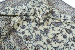 Surface texture of 2000s Nain rug with natural Wool and intricate pattern