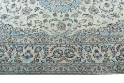 Corner detail of 2000s Nain rug showing border pattern and Wool pile