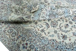 Surface texture of 2000s Nain rug with natural Wool and intricate pattern