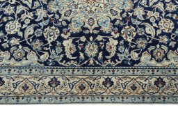Corner detail of 2000s Nain rug showing border pattern and Wool pile