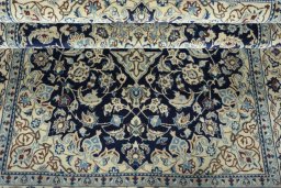 Close-up detail of 2000s Nain rug from Iran / Persia showing Wool weave