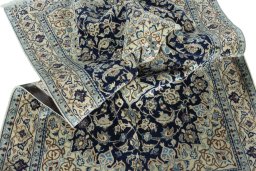 Surface texture of 2000s Nain rug with natural Wool and intricate pattern