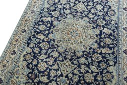 Backside of handmade 2000s Nain rug showing knot structure and weave density