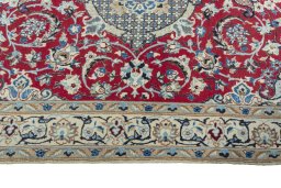 Corner detail of 2000s Nain rug showing border pattern and Wool pile