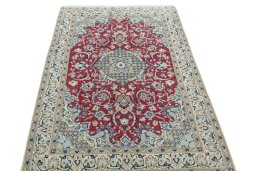 Surface texture of 2000s Nain rug with natural Wool and intricate pattern