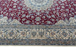 Corner detail of 2000s Nain rug showing border pattern and Wool pile