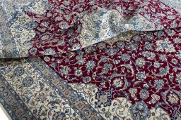 Surface texture of 2000s Nain rug with natural Wool and intricate pattern