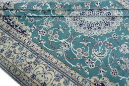 Close-up detail of 1970s Nain rug from Iran / Persia showing Wool weave