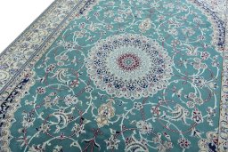 Backside of handmade 1970s Nain rug showing knot structure and weave density