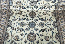 Corner detail of 1970s Nain rug showing border pattern and Wool pile