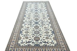 Surface texture of 1970s Nain rug with natural Wool and intricate pattern