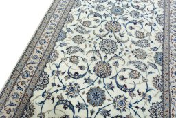 Backside of handmade 1970s Nain rug showing knot structure and weave density