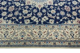Corner detail of 1970s Nain rug showing border pattern and Wool pile