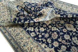 Surface texture of 1970s Nain rug with natural Wool and intricate pattern
