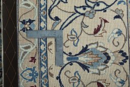 Backside of handmade 1970s Nain rug showing knot structure and weave density