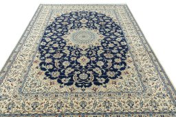 Surface texture of 1970s Nain rug with natural Wool and intricate pattern