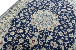 Backside of handmade 1970s Nain rug showing knot structure and weave density