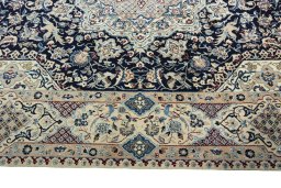 Corner detail of 1970s Nain rug showing border pattern and Cork pile