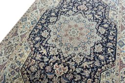 Backside of handmade 1970s Nain rug showing knot structure and weave density