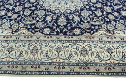 Corner detail of 1970s Nain rug showing border pattern and Cork pile