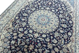 Backside of handmade 1970s Nain rug showing knot structure and weave density