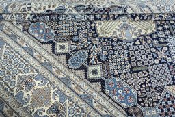 Surface texture of 1970s Nain rug with natural Wool and intricate pattern
